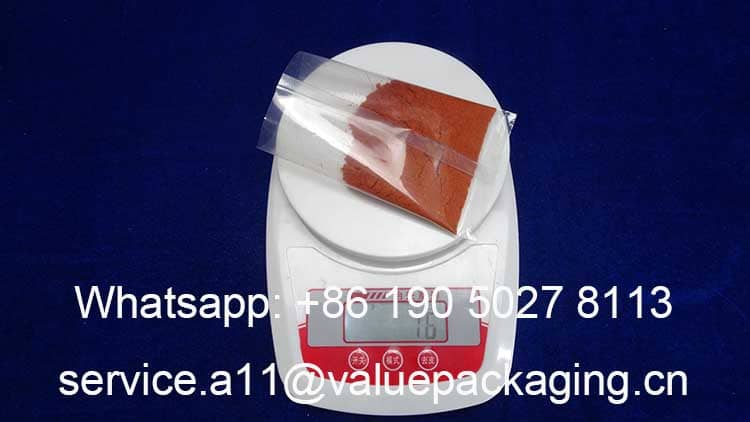 weighing-15-grams-red-chilli-powder-conditments-sachet-bag